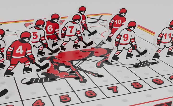 Close-up of the numbered hockey player pieces on the board